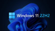Nápis na Windows 11 22H2 se základní tapetou Windows 11 na pozadí